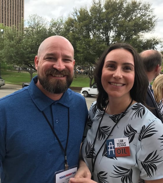 man and woman smiling at texas energy event 