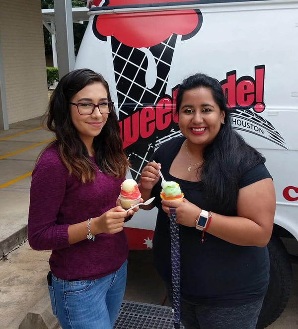 two young women holding ice cream 